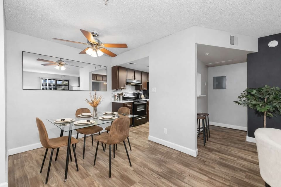 Elegant dining area with seating for four, plus a high chair for added convenience.