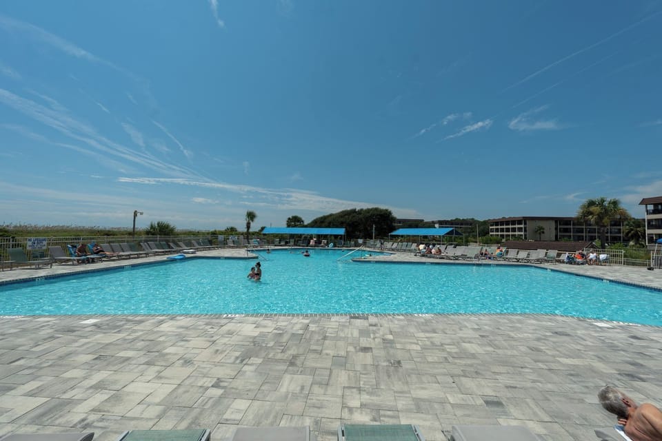 Just a short walk from the condo, you’ll find the beach and the pool.