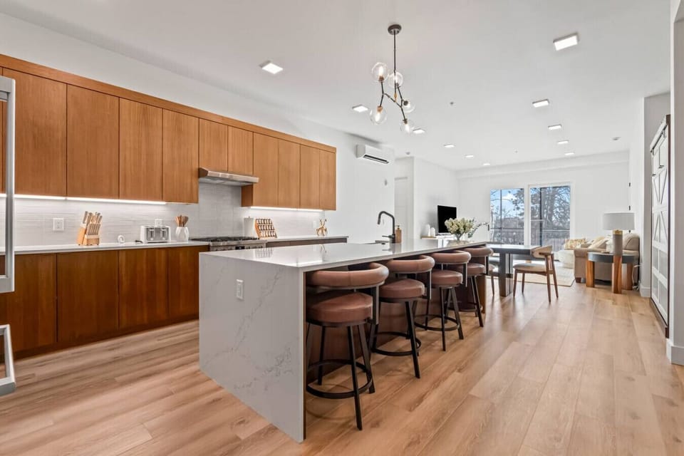 galley kitchen with 4 bar stools