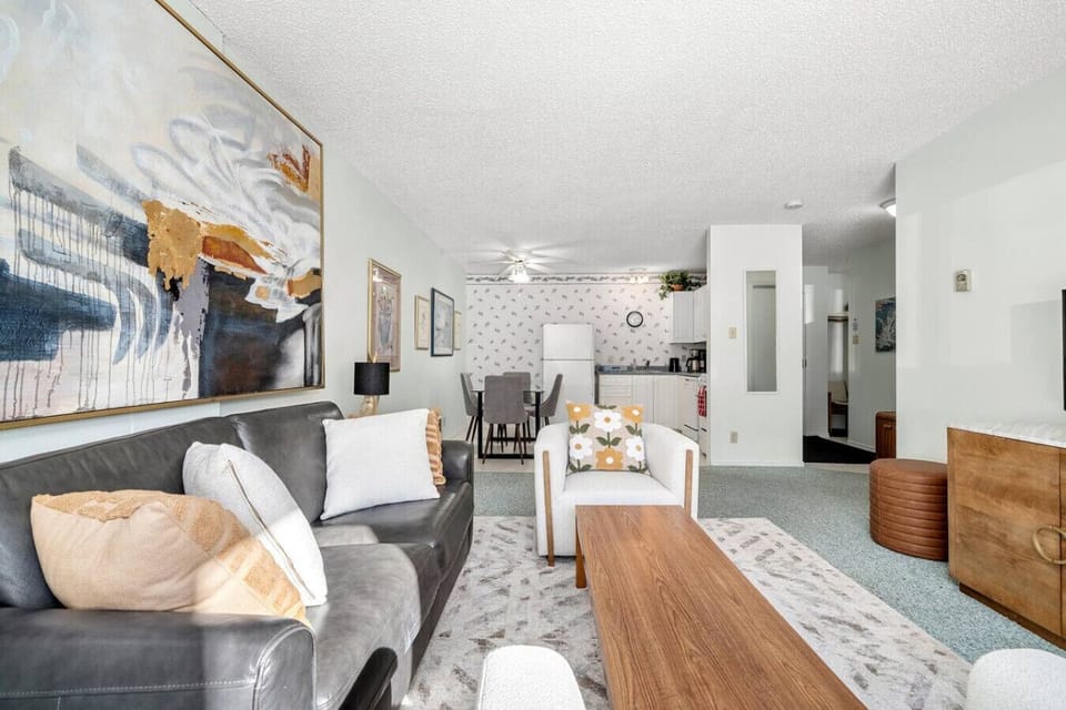 Living area with kitchen and dining table.