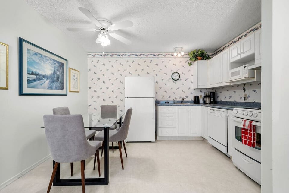 Dining table for 4 and kitchen.