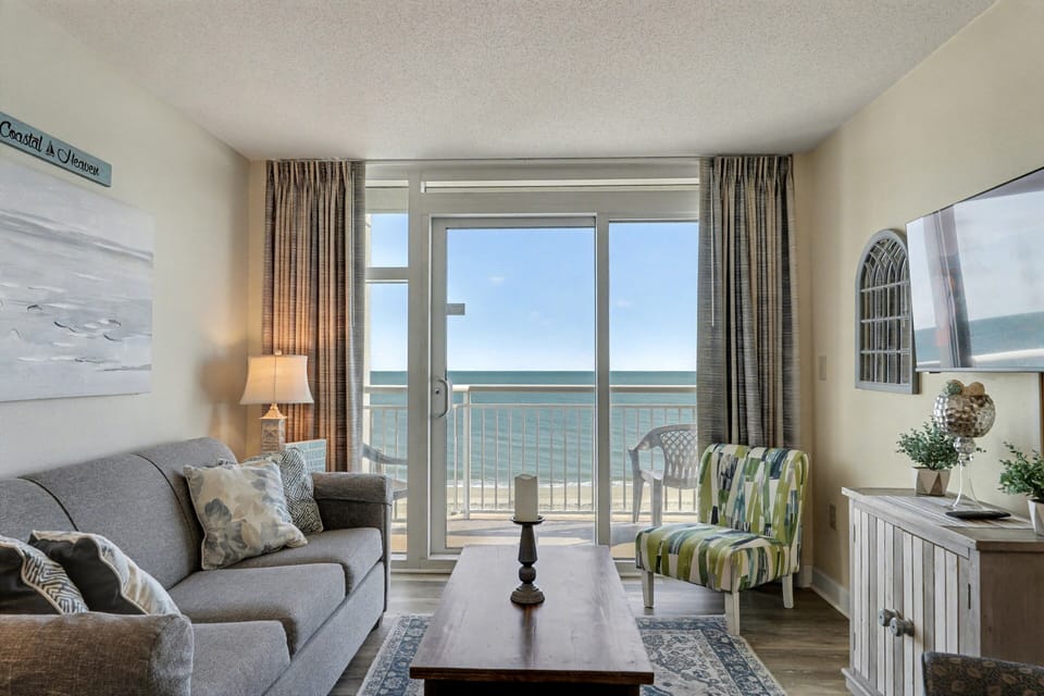 Living Room: Stunning ocean views from your charming retreat—perfect for unwinding and relaxing!