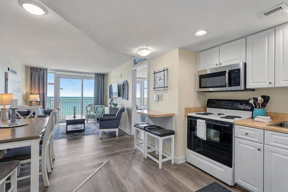 Living/Dining Room: Bright space with ocean views, perfect for relaxation and coastal vibes!