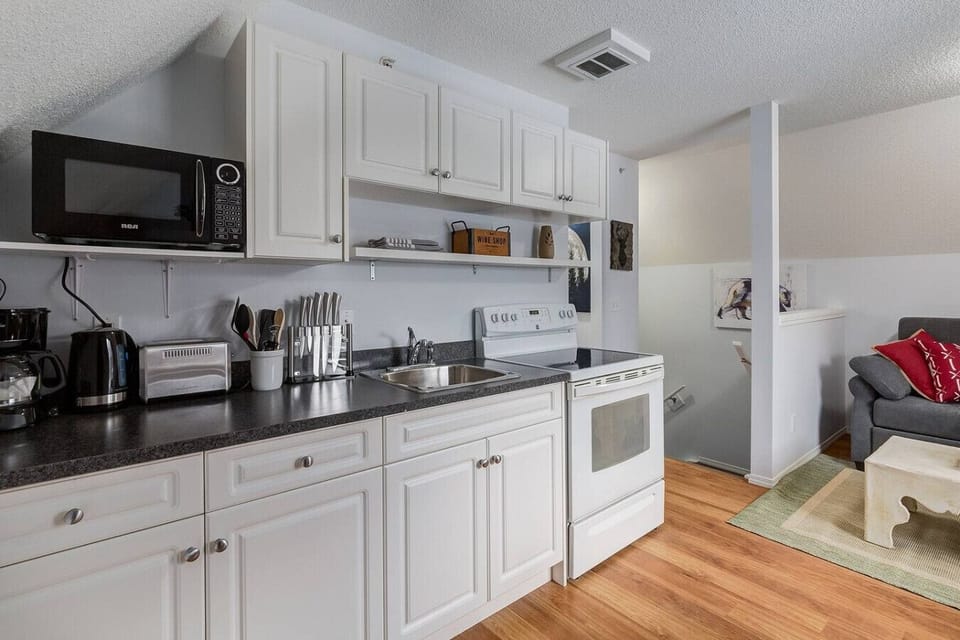Kitchen fully stocked to with all the basics
