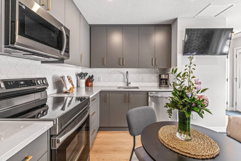 The kitchen is stocked with basic cookware and kitchen utensils such as:Basic Plate SetWater GlassesWine Glass SetSilverware SetCoffee MugsPots & PansTV is not working since there is no wifi to this new unit yet.