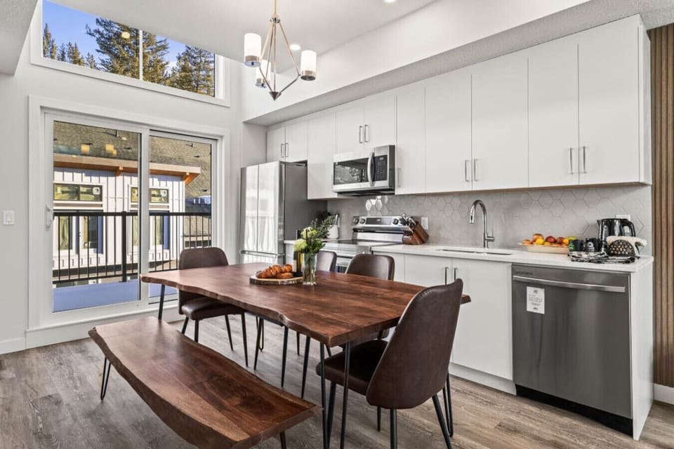 The dining table comfortably seats six or seven and is the perfect spot to gather for a delightful meal.