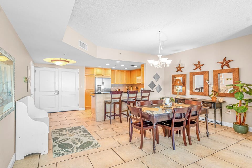 Gather around this spacious dining area where coastal charm meets comfort—your perfect spot for memorable meals together.