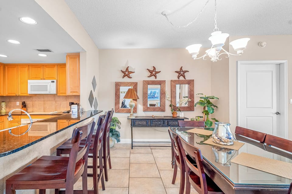 Your fully-equipped kitchen flows into an elegant dining space perfect for gathering around memorable meals with loved ones.