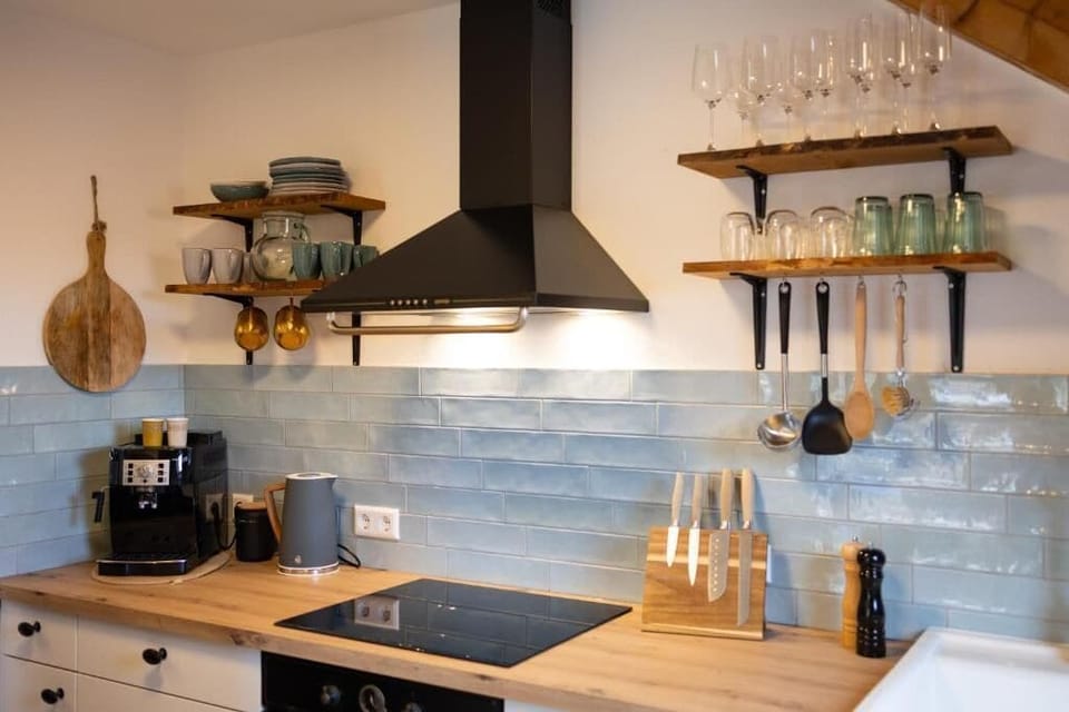 Deluxe Apartment, Balcony, Garden View | Private kitchen | Electric kettle, toaster, highchair