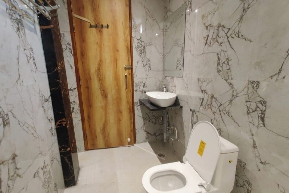 Family Triple Room, City View | Bathroom | Slippers, towels, soap, shampoo