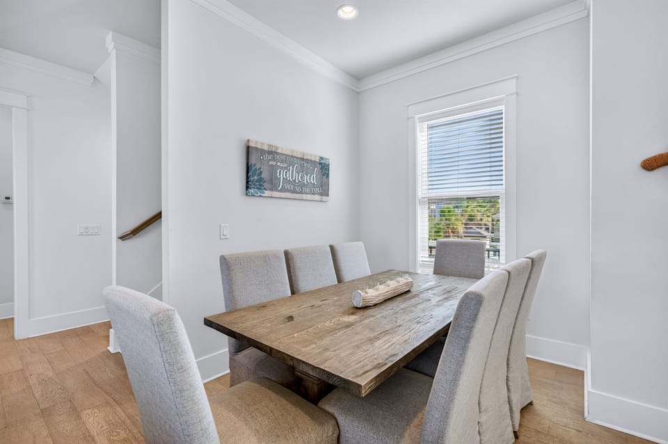 2nd Floor - Inviting dining room with generous seating, perfect for family meals, celebrations, and gathering together after a day at the beach. Conveniently located next to the kitchen for easy serving and entertaining.