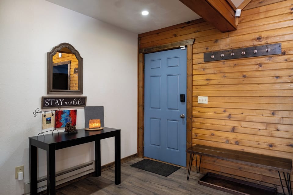 Step into your welcoming entryway with rustic wood accents and thoughtful touches that make you feel instantly at home.
