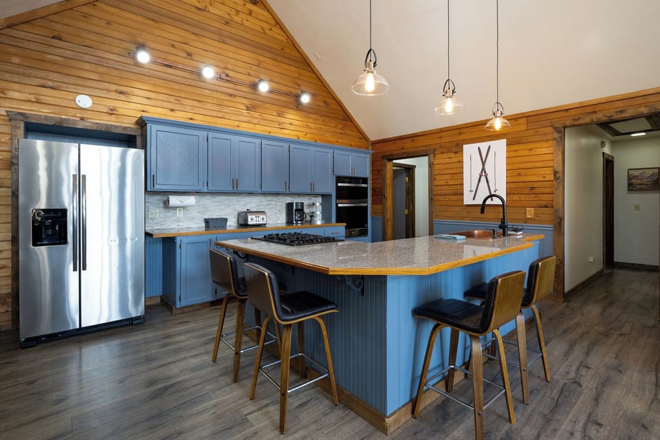 Your gourmet kitchen awaits with granite counters, stainless appliances, and a spacious island perfect for cooking memorable meals together.