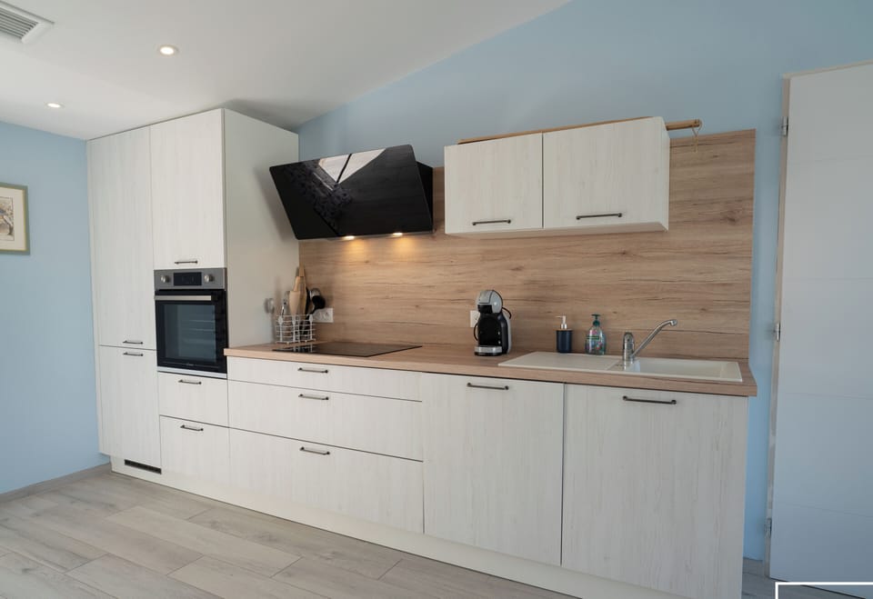 Kitchen opening onto the living area