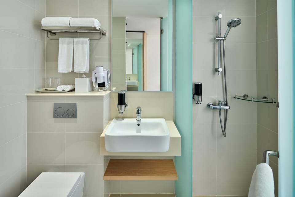 Shower, free toiletries, hair dryer, slippers