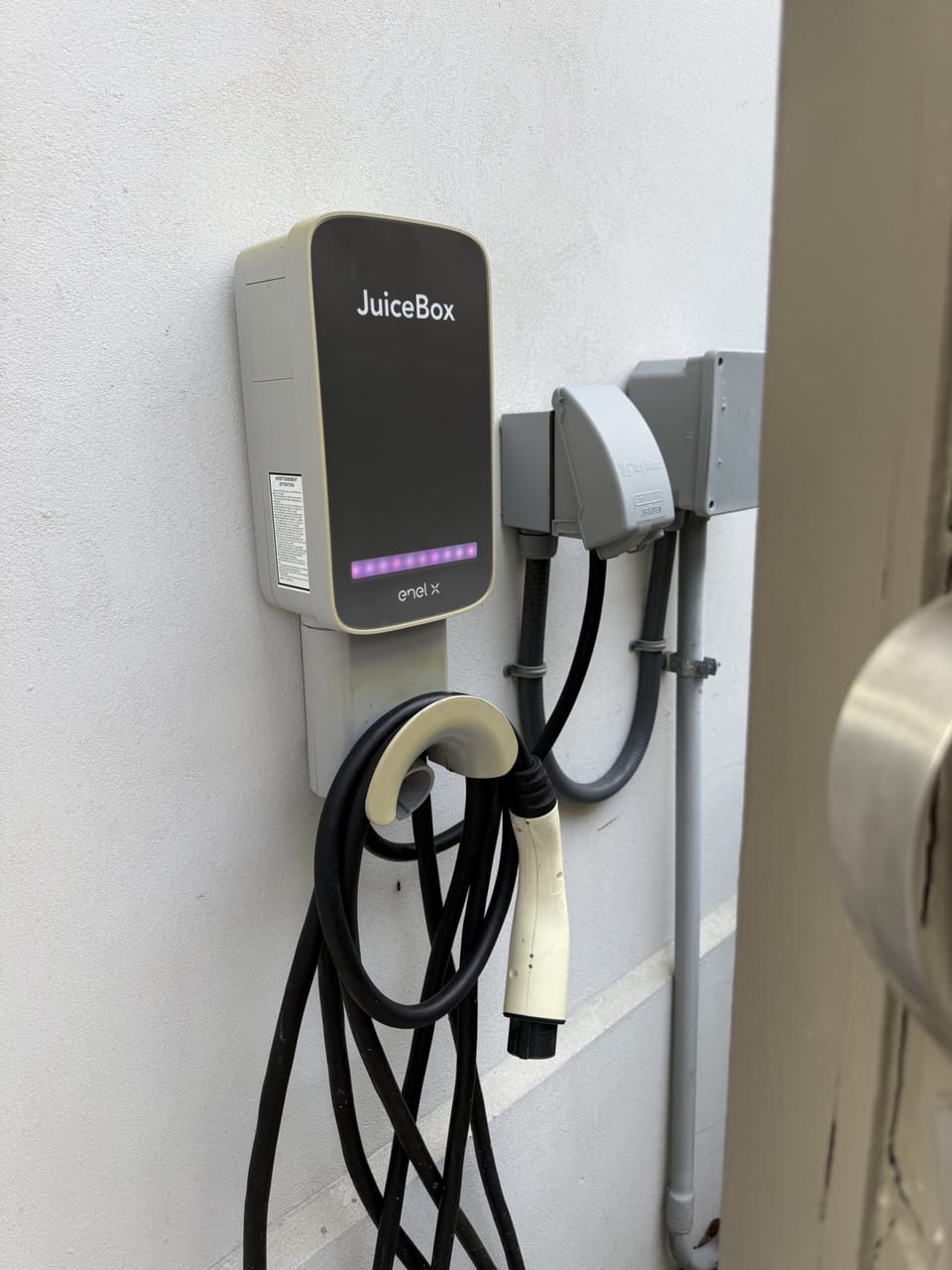 Convenient on-site EV charger in the covered parking area