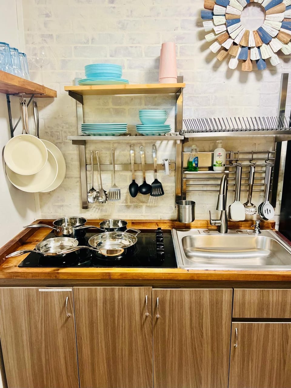 Fully stocked kitchen, electric stove, microwave and full fridge 