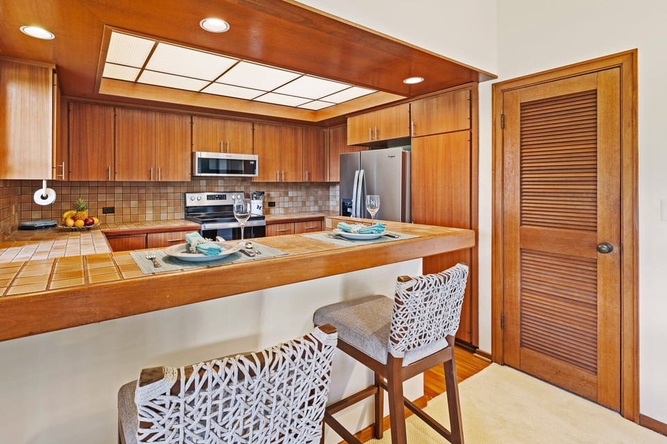Fully equipped kitchen with breakfast bar for casual dining and quick meals