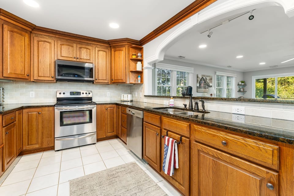 Experience culinary delights with modern appliances and bright, inviting views!