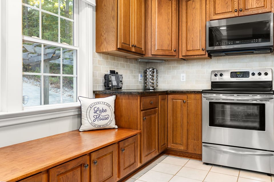 Wooden cabinetry & natural light create the perfect space for culinary delights!