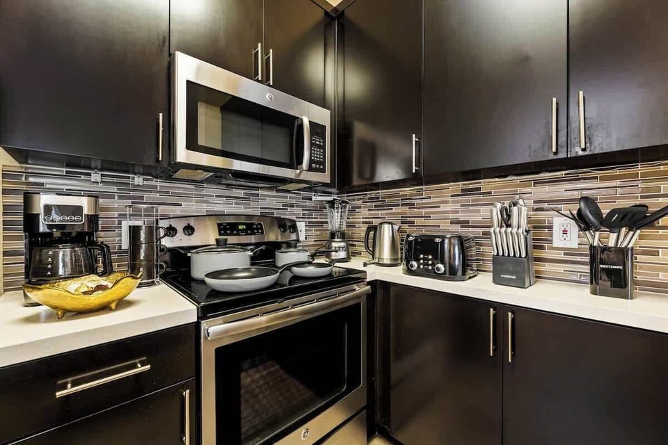 Fully equipped kitchen with modern appliances, cookware, and everything you need for home cooking.