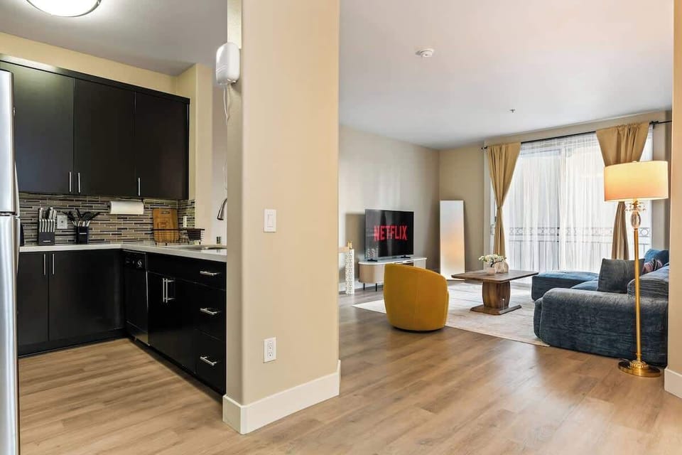 Modern full kitchen with stainless steel appliances, plenty of storage, and all essentials for cooking.
