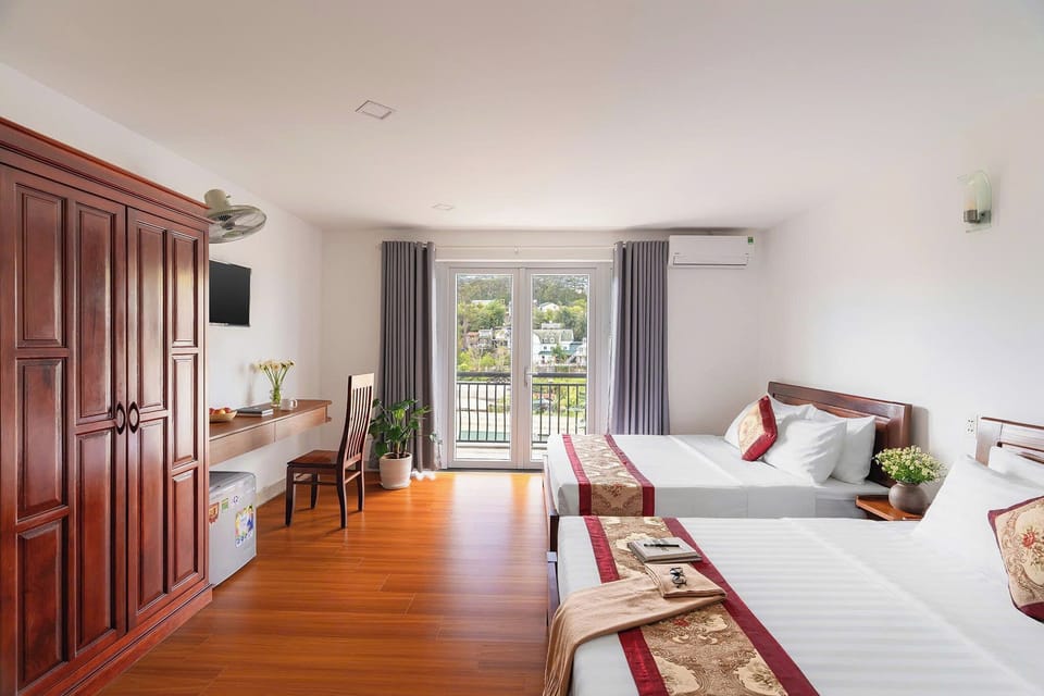Deluxe Quadruple Room, 2 Queen Beds, Air conditioning, City View | Desk, laptop workspace, free WiFi