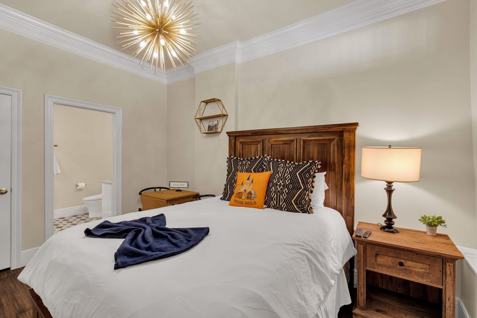 Cozy Queen bed with classic New Orleans charm