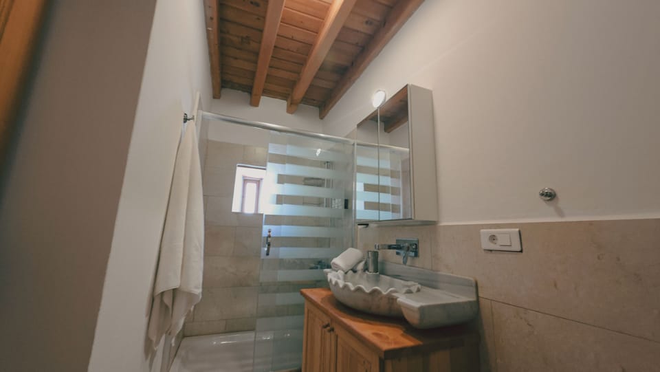 Family Double Room, Balcony, Garden View | Bathroom | Shower, hair dryer, slippers, towels