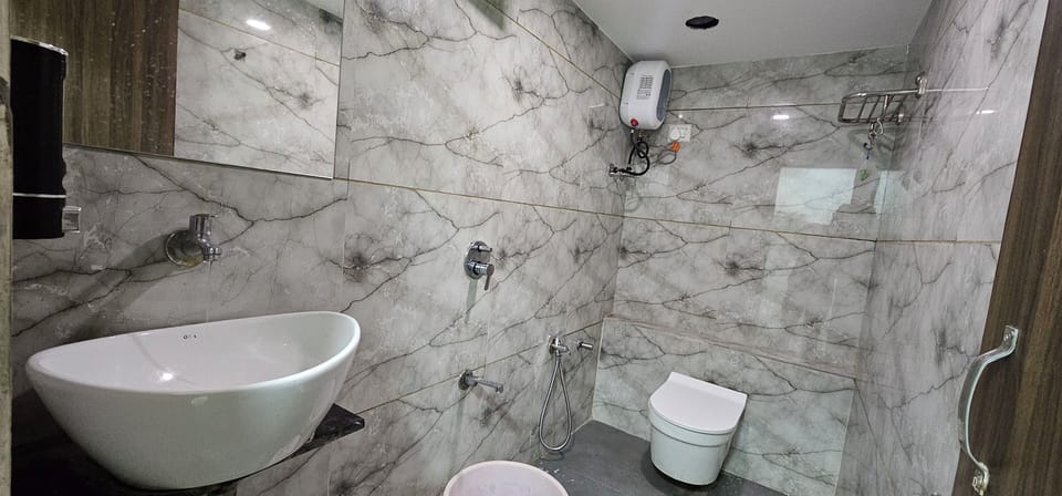 Deluxe Double Room, City View | Bathroom | Shower, free toiletries, slippers, towels