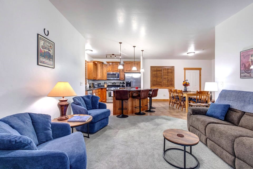 Unwind in your spacious open-plan retreat with plush seating, full kitchen, and dining area perfect for memorable meals together.