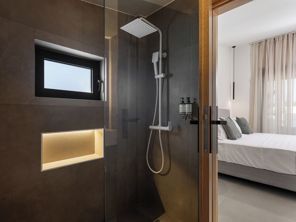 Villa Melody | Bathroom | Shower, rainfall showerhead, hair dryer, bathrobes