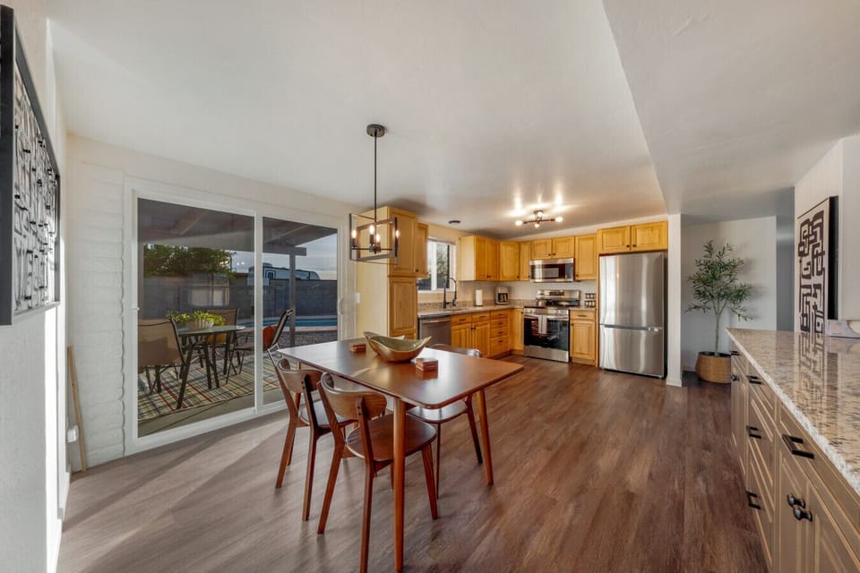 Lovely dining area, just off the kitchen, with views of the beautiful and spacious backyard