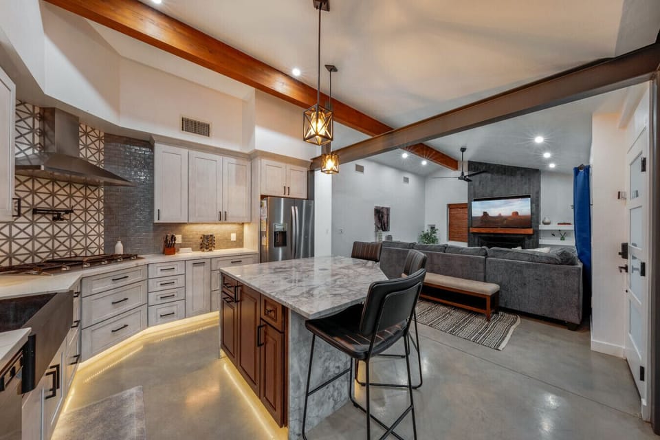 Stunning, updated kitchen and spacious living room with smart TV, ceiling fan, and gas fireplace (not functional)