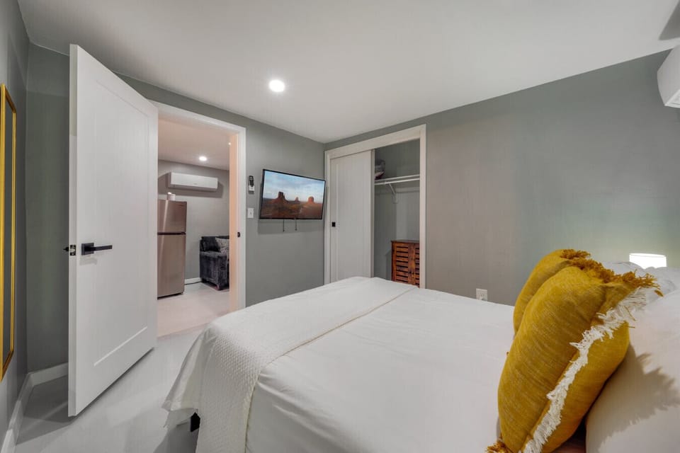 Bedroom with cozy double bed, smart TV, and closet (mini split provides heating and cooling for the bedroom)
