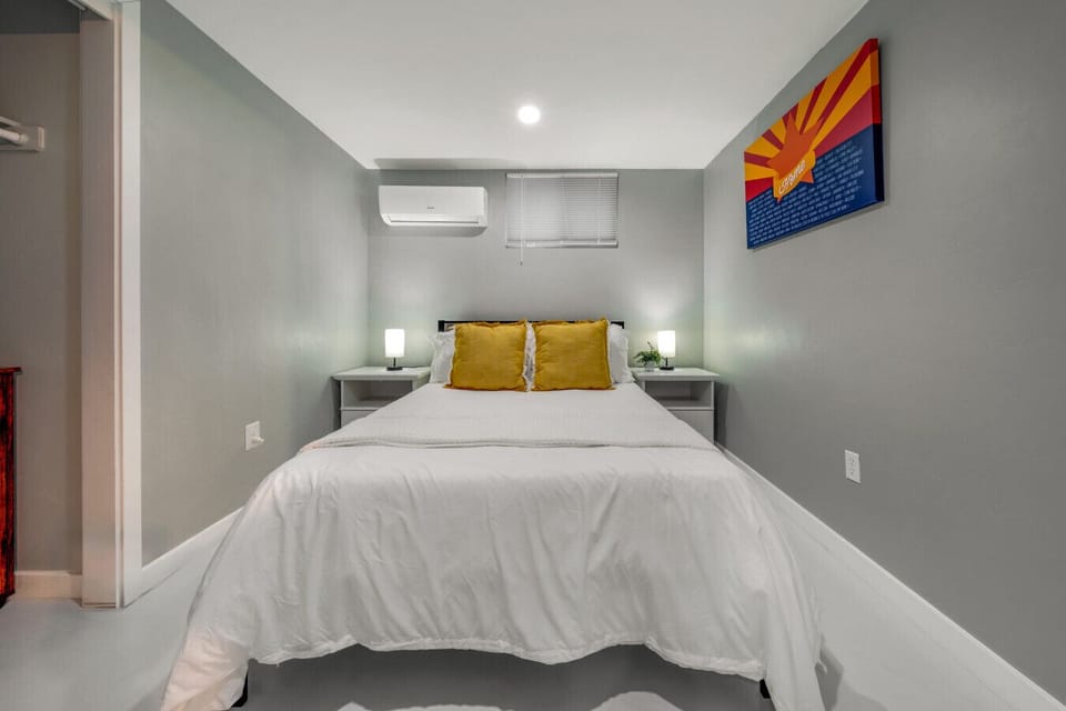 Bedroom with cozy double bed, smart TV, and closet (mini split provides heating and cooling for the bedroom)
