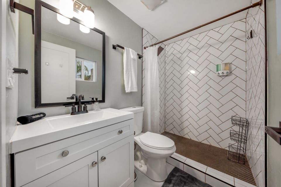 Bathroom with beautifully tiled walk-in shower