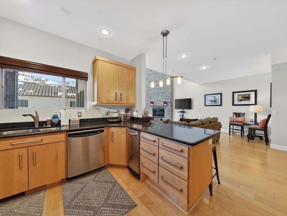 Your spacious kitchen flows seamlessly into the living area, perfect for cooking while staying connected to your group.