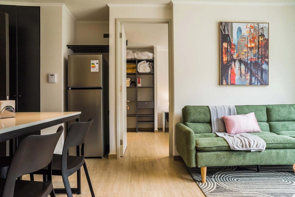 Cozy living area with modern decor and easy access to the bedroom, perfect for relaxation.