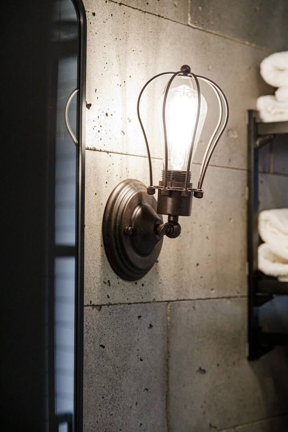 Soft ambient lighting with an industrial touch creates a cozy nighttime atmosphere.