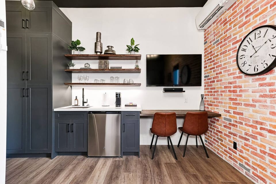 The desk and dining workspace is crafted from restored wood from the original 1800s building. A functional area for meals, laptop time, or planning your day.