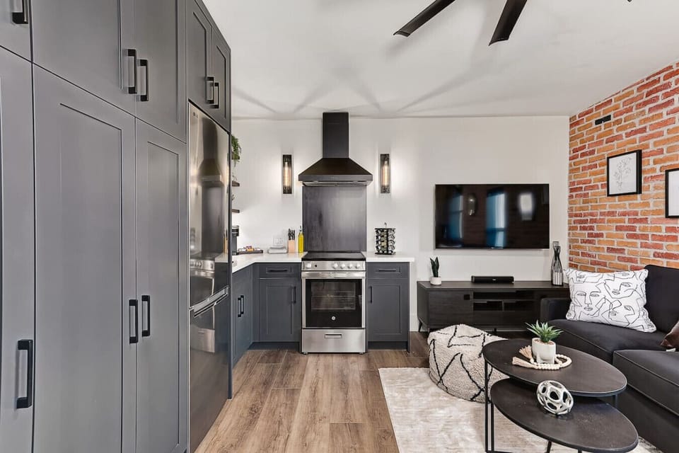 Open-concept design connecting the kitchen and living area, with a queen pull-out sofa that makes the suite perfect for families or groups of up to four.