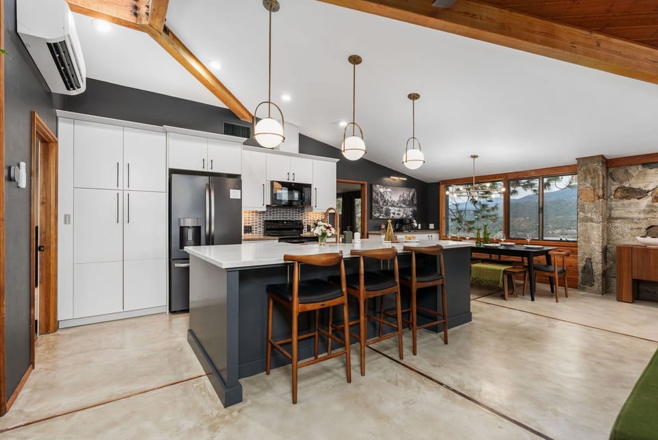 The updated kitchen and dining area offer plenty of room to comfortably host family dinners and are outfitted with all the cookware, dishes, utensils, and appliances you will need to cook delicious meals.