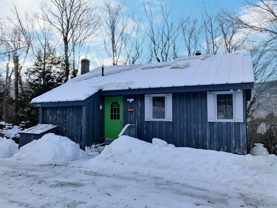 A warm and welcoming house on a crisp snowy day.