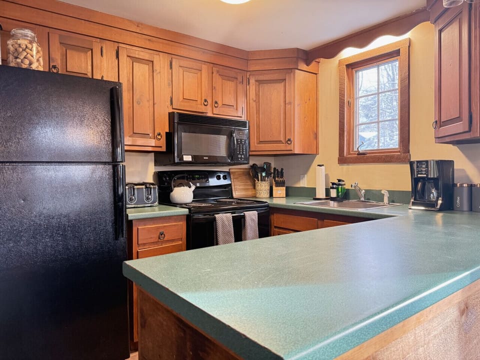 This space includes a complete kitchen for all your dining and cooking needs.