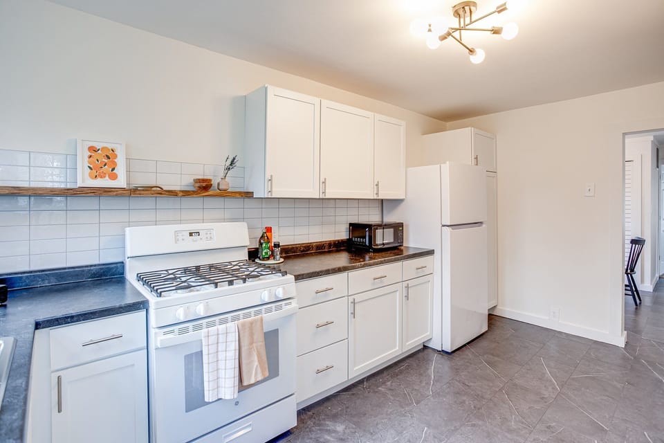 Kitchen with gas range and everything you need to cook. 