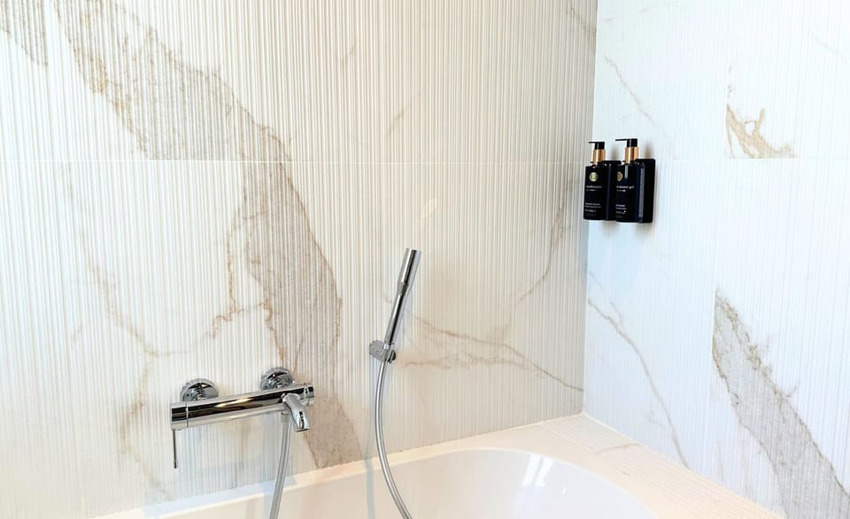 Panoramic Double or Twin Room, Balcony, City View | Bathroom | Hair dryer, slippers, towels, soap