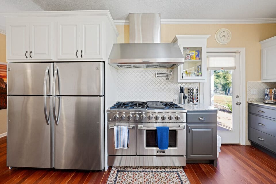 From granite countertops to bar seating and top-tier appliances, this kitchen brings style, comfort, and convenience to every stay.