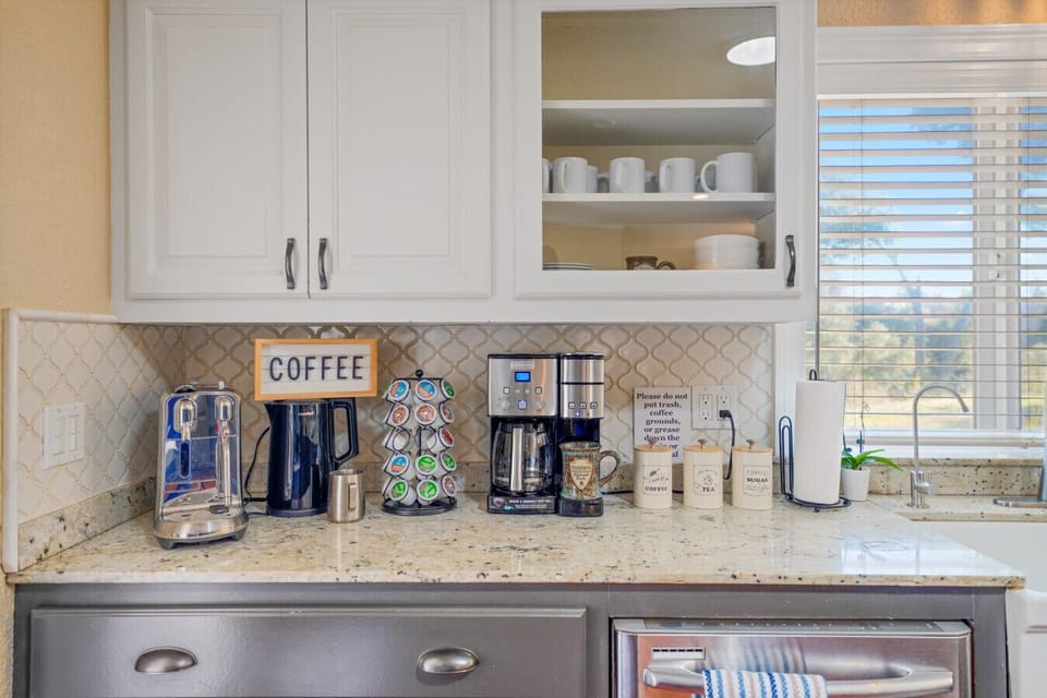 This chef`s kitchen is perfect for cooking together or sipping morning coffee from the dedicated coffee bar.