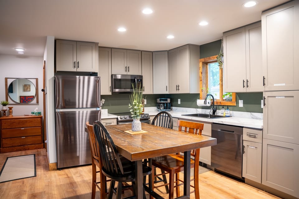 Table with six chairs. Open floor plan.